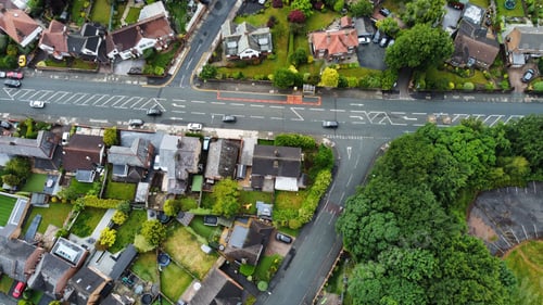 Preview: Aerial top view of suburbs with beautiful houses and green lawns