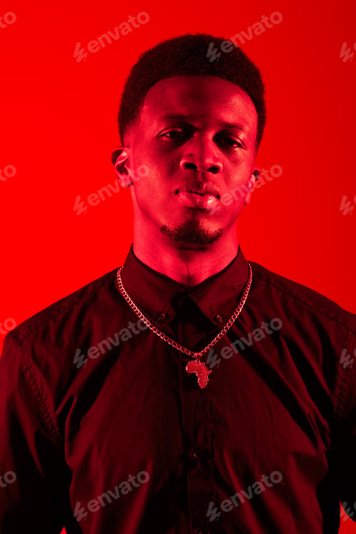 Preview: Black man standing in front of red background