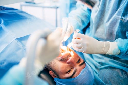 Preview: Team dental surgeons working in dental clinic.
