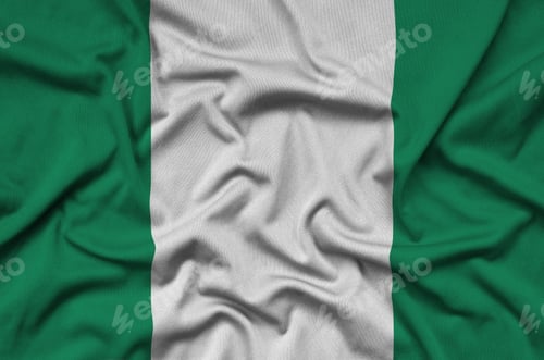 Preview: Nigeria flag is depicted on a sports cloth fabric with many folds. Sport team waving banner