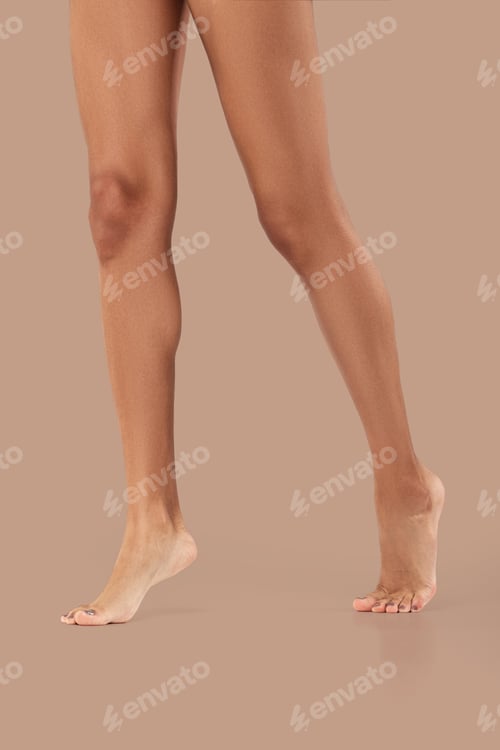 Preview: Bare legs of african girl model