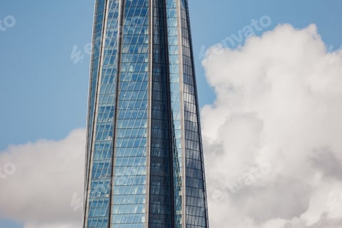 Preview: white cumulus clouds on blue sky glass building, beautiful view of sky and storm clouds.