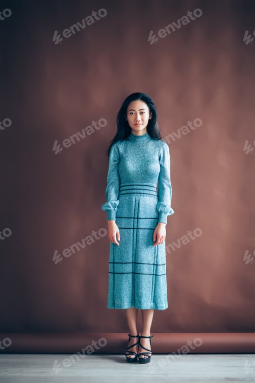 Preview: Full length portrait of beautiful asian girl in blue dress