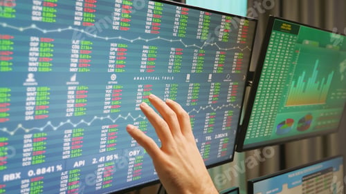 Preview: Close up of stock market trader hand on monitors