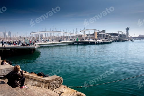 Preview: People enjoying a sunny day at the bustling harbor