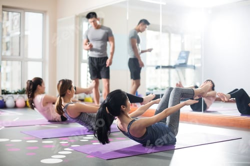 Preview: Young women exercising at gym