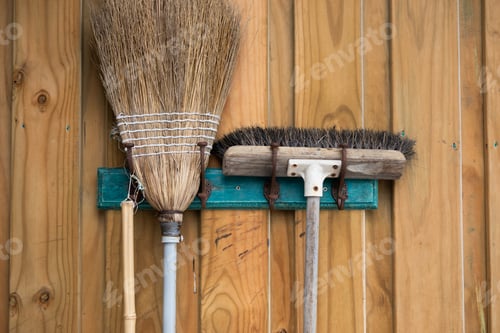 Preview: old wooden broom hanging wall