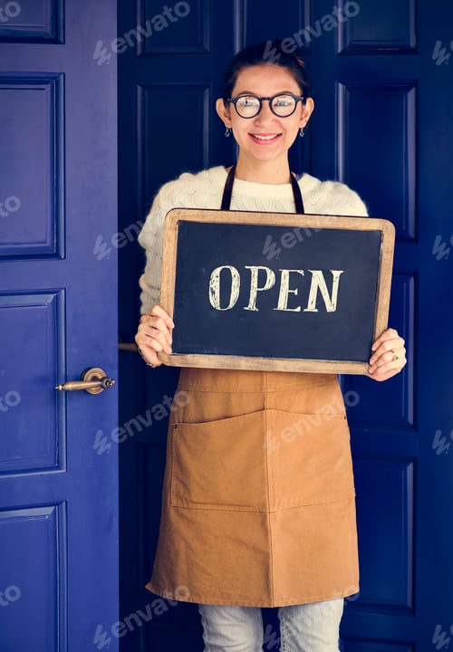 Preview: A cheerful small business owner with open sign