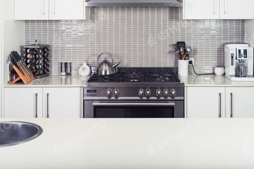 Preview: Modern kitchen interior with the stove and utensils with island table