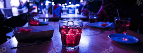 Preview: Closeup shot of glass with juice and ice in the cafe