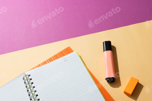 Preview: Flat lay of notebooks and highlighter with copy space on pink and yellow background