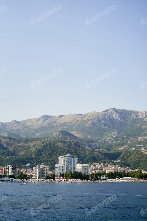 Preview: Embankment of the new town of Budva at the foot of the green mountains. Montenegro