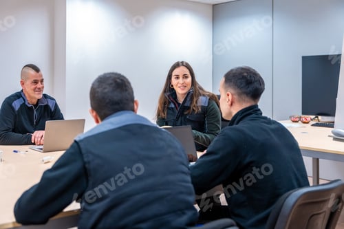 Preview: Team of coworkers during a meeting in room of factory