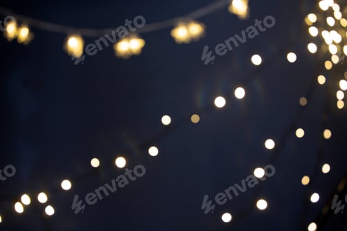 Preview: Blurred Christmas lights over dark blue background