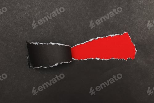 Preview: curl of torn black paper on red background. advertising and sale concept. copy space