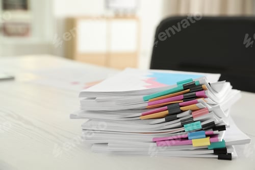 Preview: Stack of documents with paper clips on office table