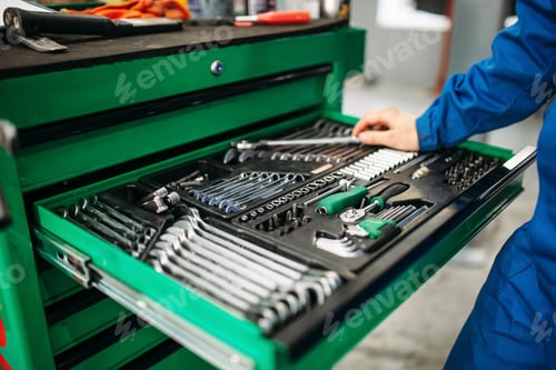 Preview: Repairman hand reaching for the tool box