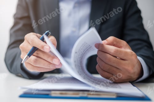 Preview: Businessman signing on contract documents after reading, man holding pen and approve