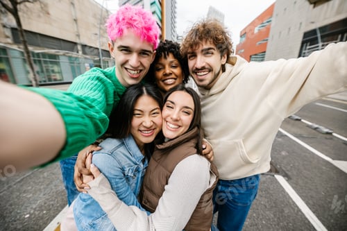 Preview: Group of young friends taking selfie on city street