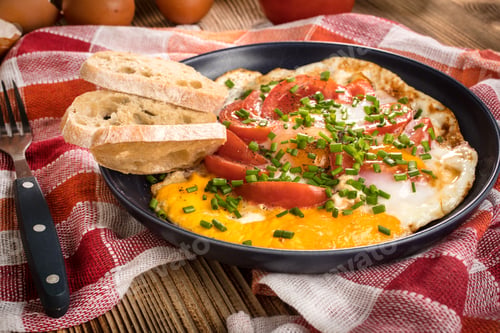 Preview: Homemade breakfast fried egg with tomato.