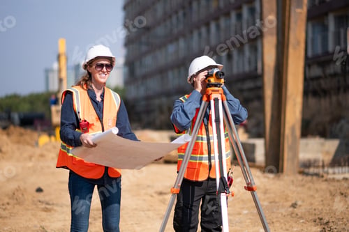 Preview: Construction surveyor or engineer working in pipe construction site inspection