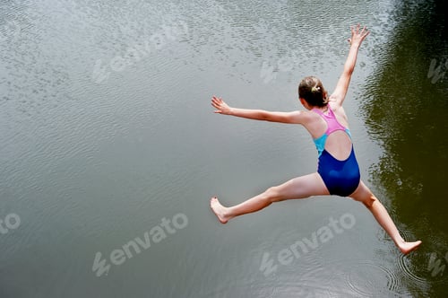 Preview: Overhead view of girl jumping into lake
