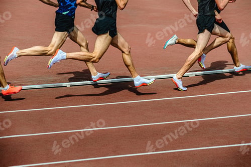Preview: group athletes running 800 meters at stadium