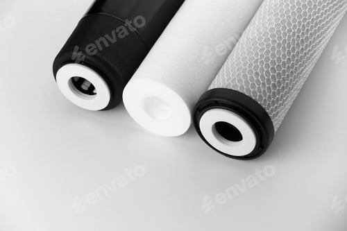 Preview: Cropped three filter cartridges for house water filtration system isolated. Foamed polypropylene,