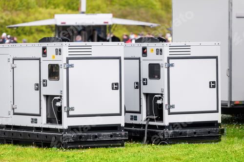 Preview: Set two large portable industrial power fuel generator green lawn at commercial event outdoors clear