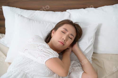 Preview: Woman sleeping on the bed in bedroom