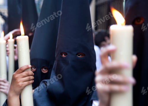 Preview: Children in robes with lit candles at a procession in Holy Week, Spain.