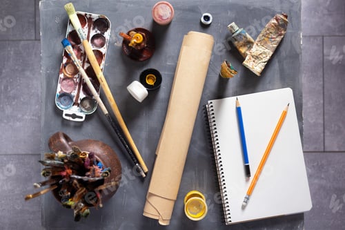Preview: Paintbrush and tubes with painter tools at abstract table background texture. Art painter concept