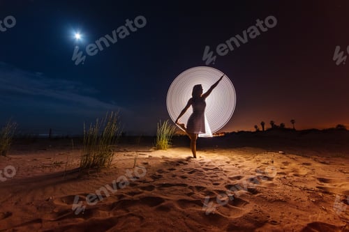 Preview: Silhouette of woman with colored lights