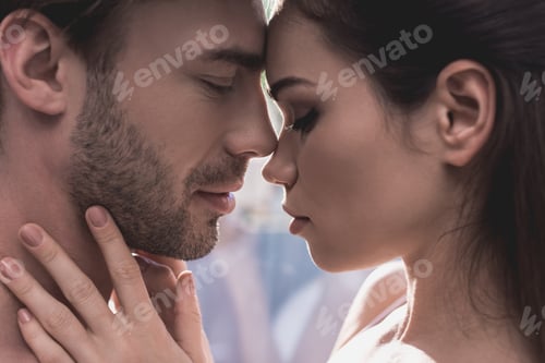 Preview: side view of sensual couple in love with eyes closed