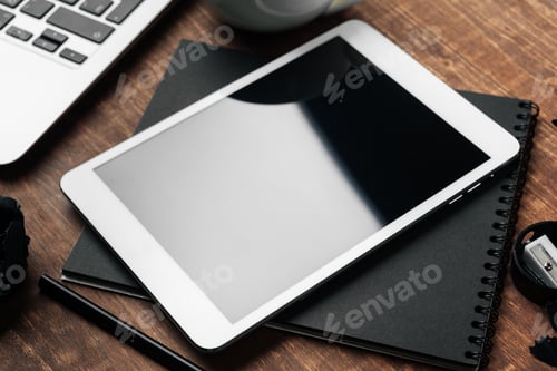 Preview: electronic gadgets and office supplies on wooden table