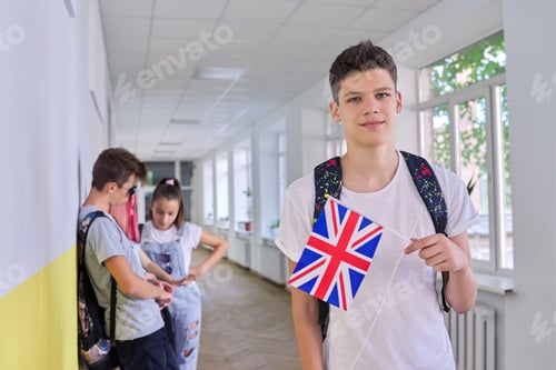 Preview: Teenager student with British flag, school corridor group of students background
