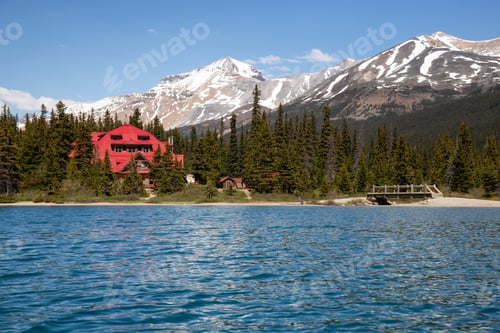 Preview: Cabin at a Glacier lake during a vibrant sunny summer day