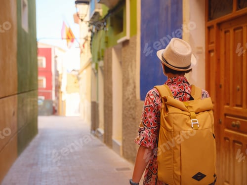 Preview: Woman strolls through colorful streets of Spanish coastal town