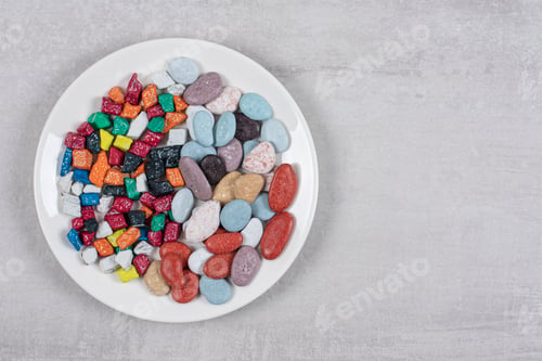 Preview: Colorful various stone candies on white plate