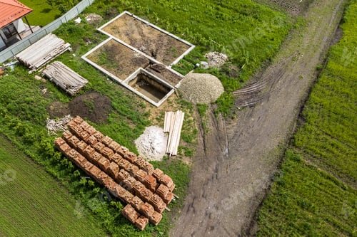 Preview: Aerial view of building site for future brick house, concrete foundation floor