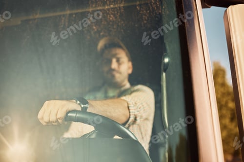 Preview: Close up or professional driver driving a truck.