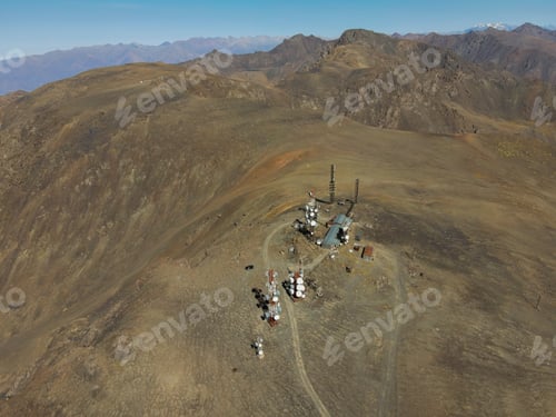 Preview: Aerial shot of mountain communications site with surrounding tracks