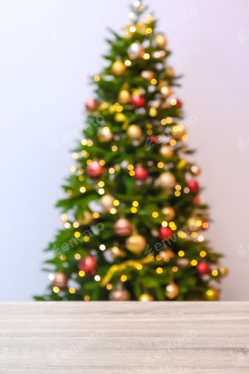 Preview: Wooden table and blurred Christmas tree with fairy lights on background