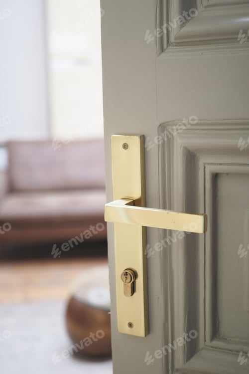 Preview: open door concept with Door handle and blur interior room background,