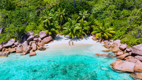 Preview: couple men and women vacation at the Seychelles visiting the tropical beach of Anse Lazio