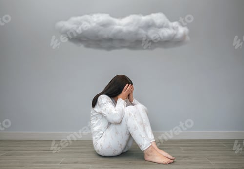 Preview: Woman with mental health problems covering her face with hands under a dark cloud