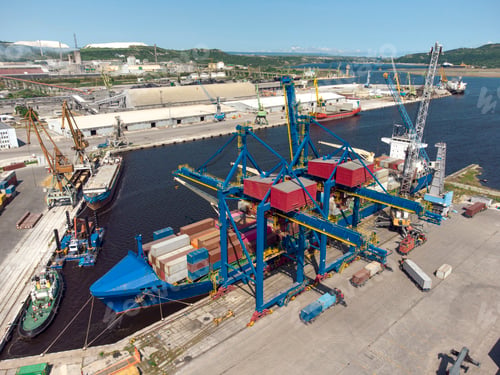 Preview: Aerial view of a container ship being loaded and unloaded at container terminal freight port
