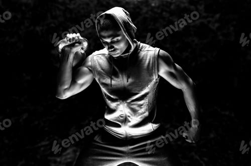 Preview: Portrait Of An Athlete Lifting A Weight Up. The Concept Of Sport And Healthy Lifestyle. Mixed Media