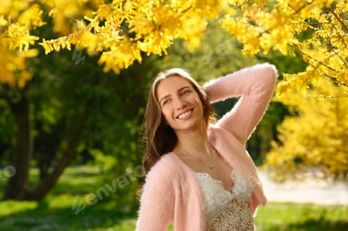 Vista previa: Beautiful young woman near blossoming shrub on spring day, space for text