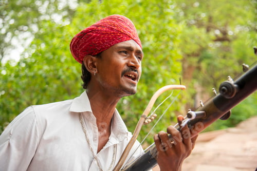 Preview: Street musician playing music instrument